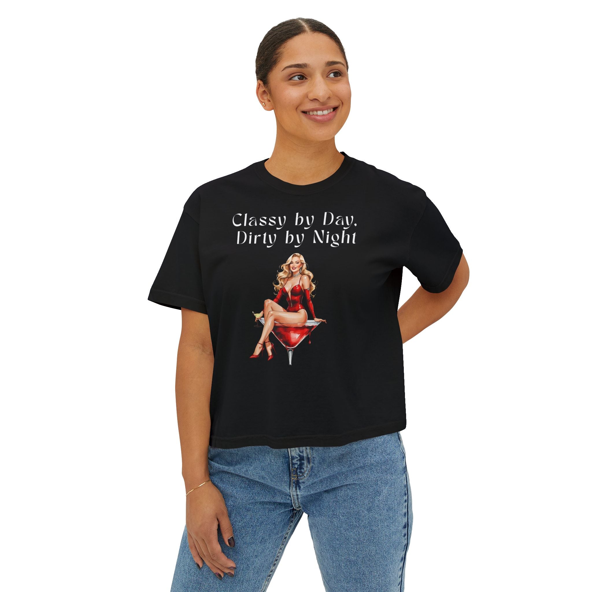 Person wearing a black t-shirt with a graphic and text, standing against a white background