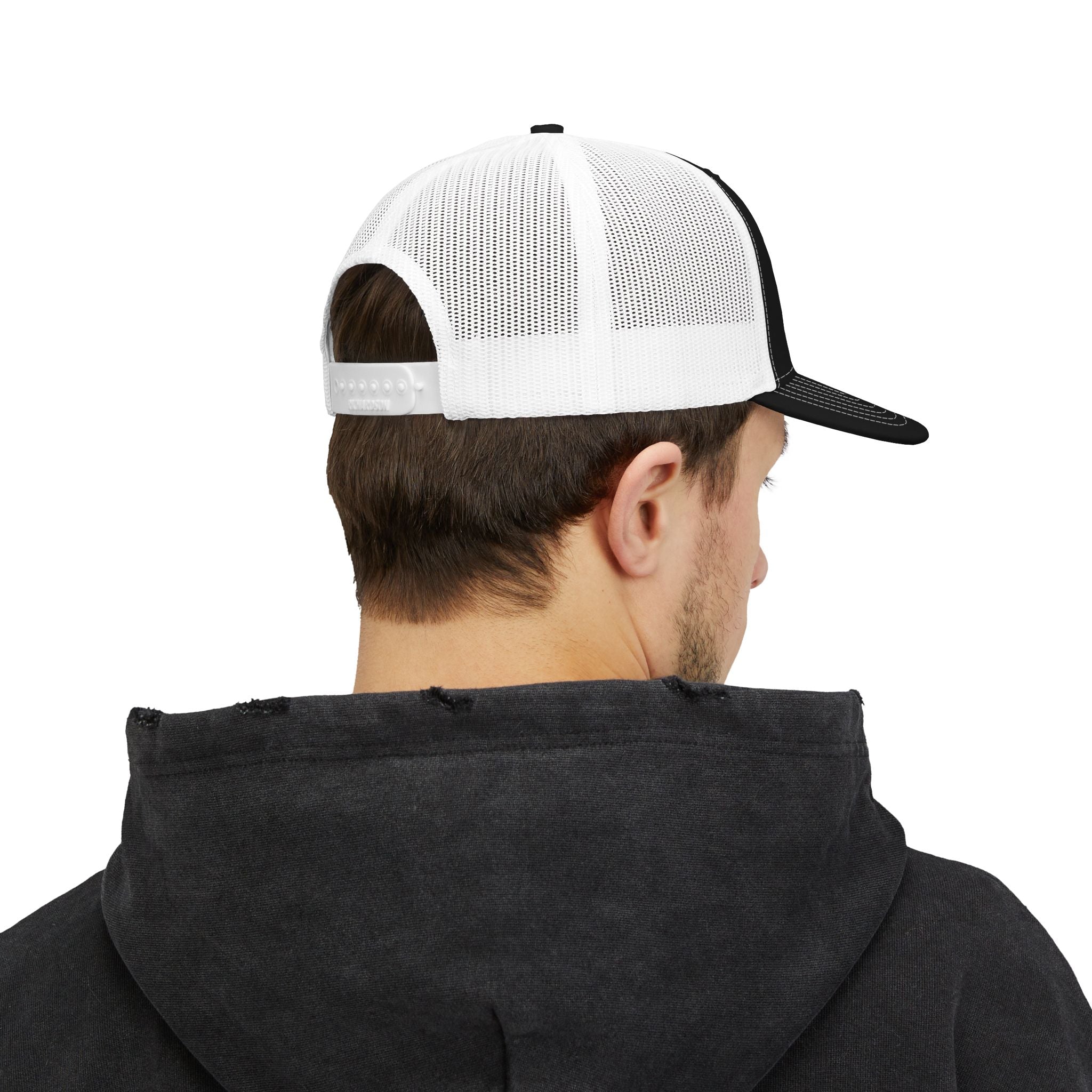 Person wearing a black hoodie and white and black cap on a white background