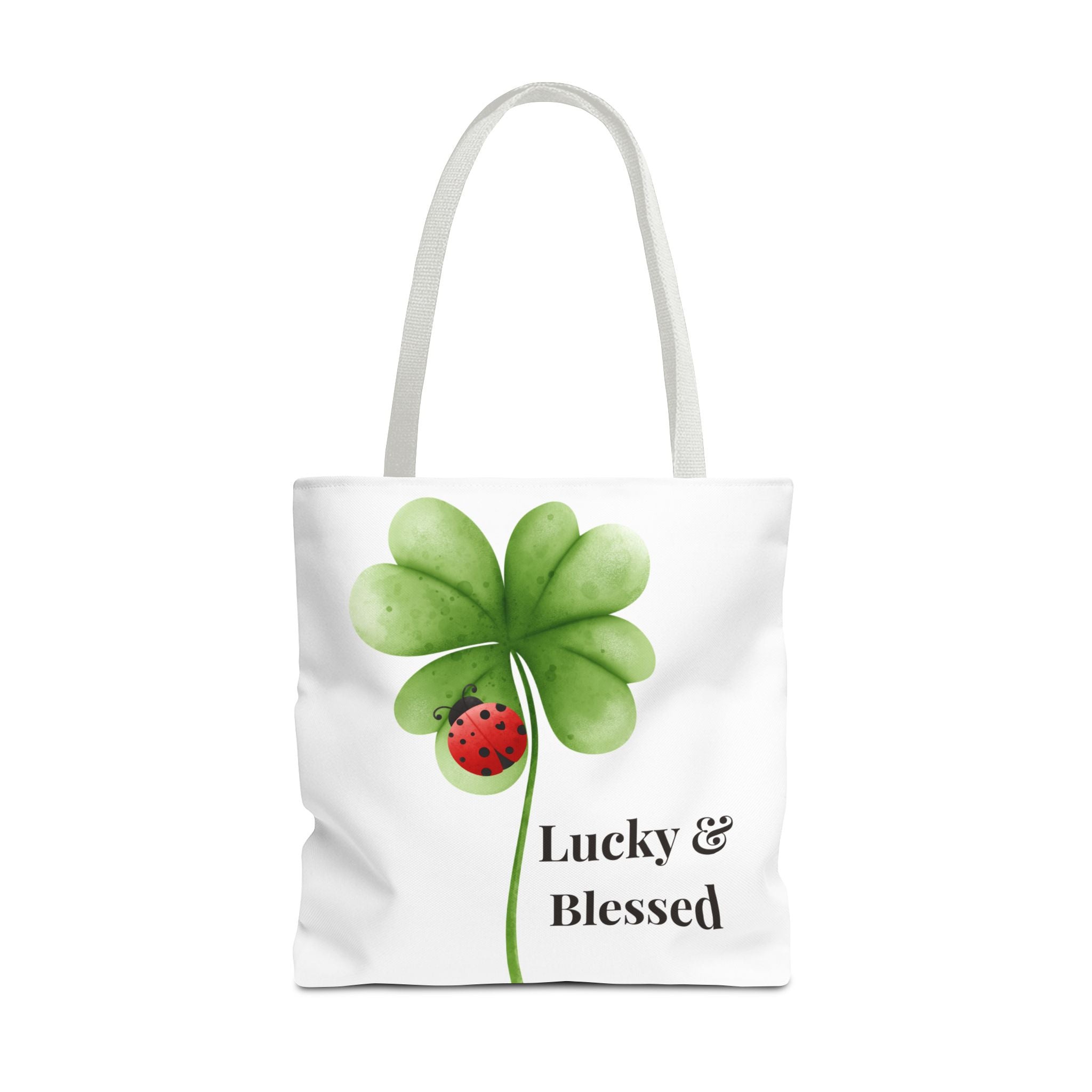Tote bag with a four-leaf clover and ladybug design on a white background
