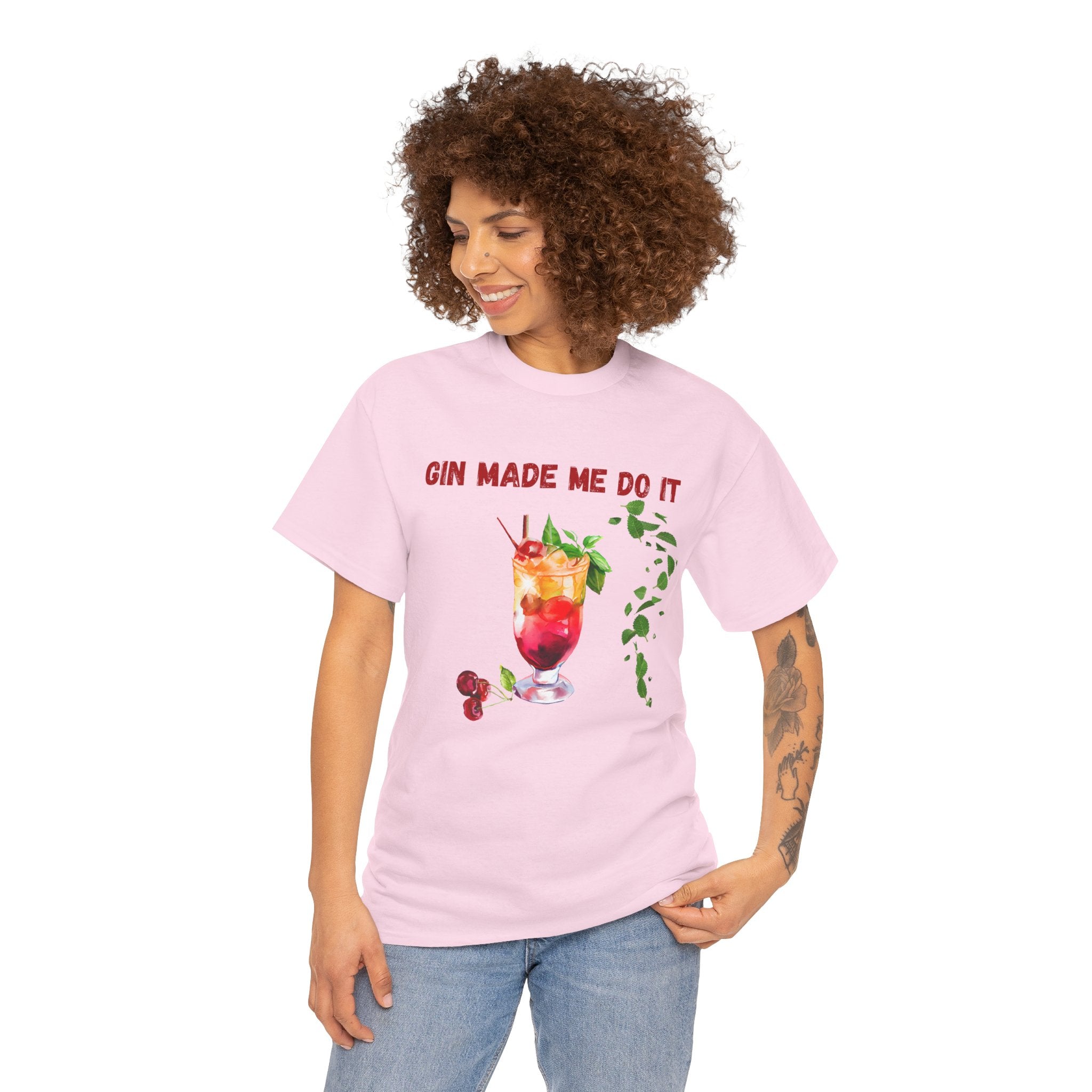 Person wearing a pink t-shirt with a drink graphic and text on a white background