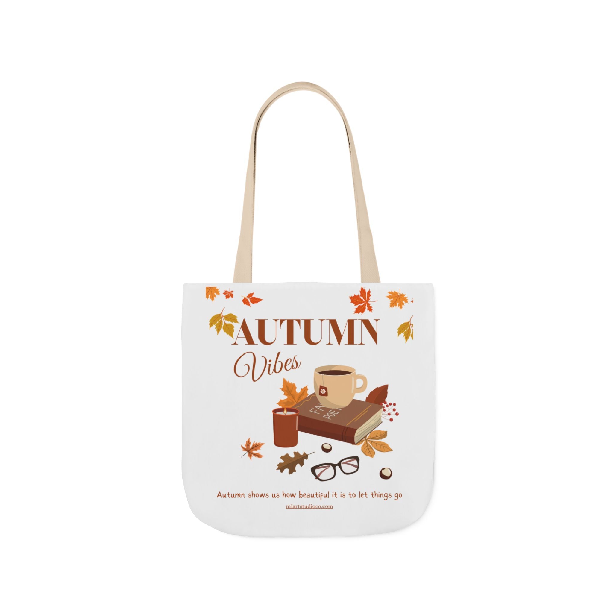 Tote bag with 'Autumn Vibes' design featuring a cup, book, and leaves on a white background