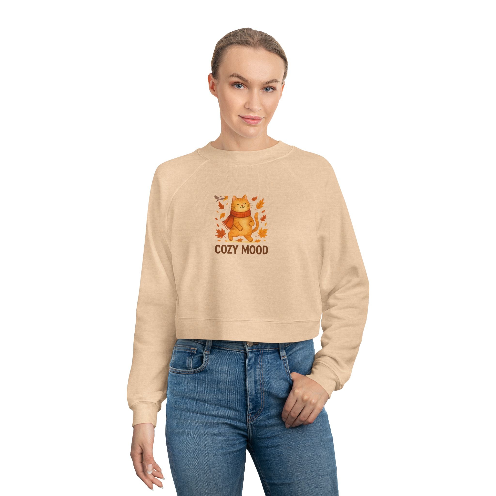 Person wearing a beige sweatshirt with a graphic and text 'COZY MOOD' on a white background