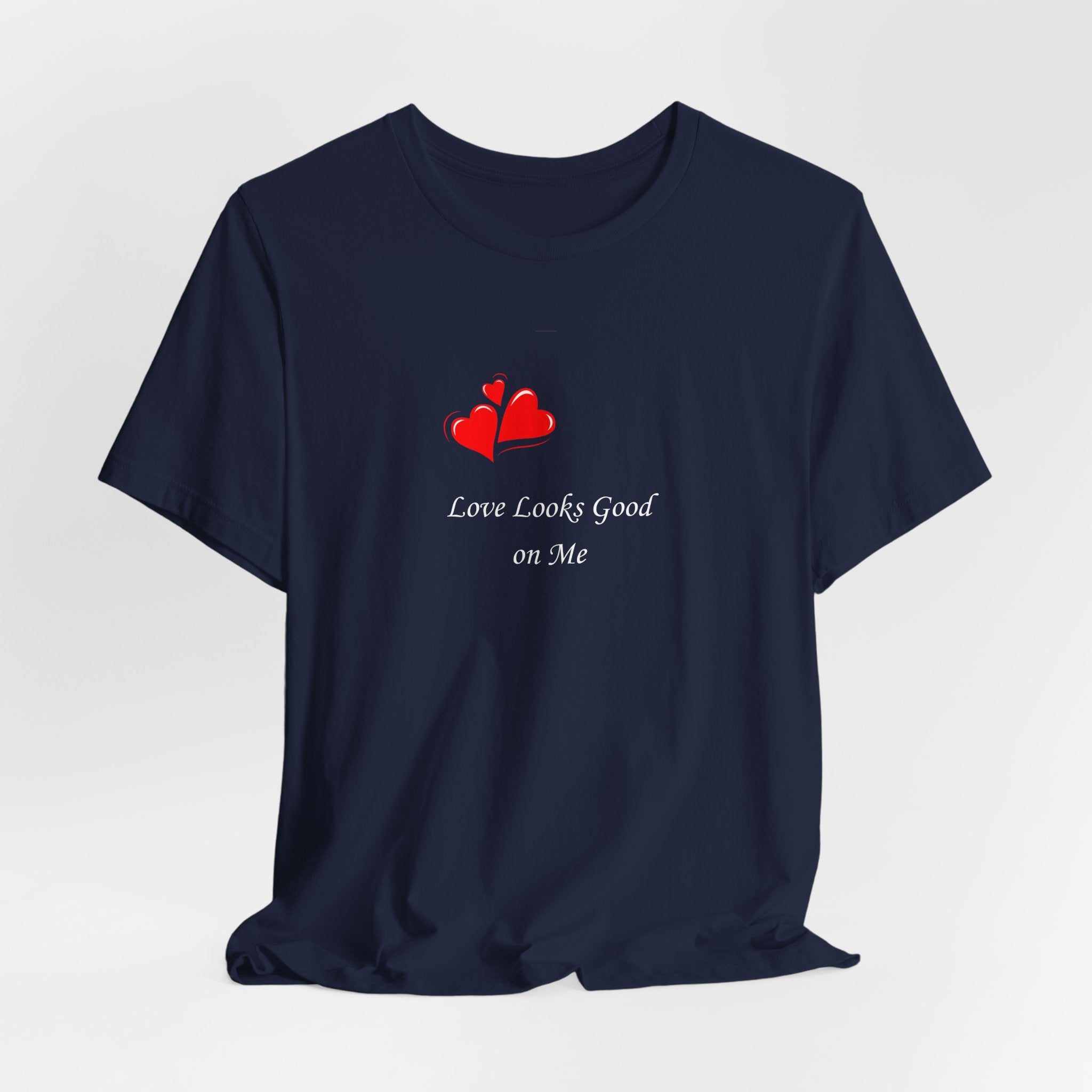 Navy blue t-shirt with red heart design and text on a white background