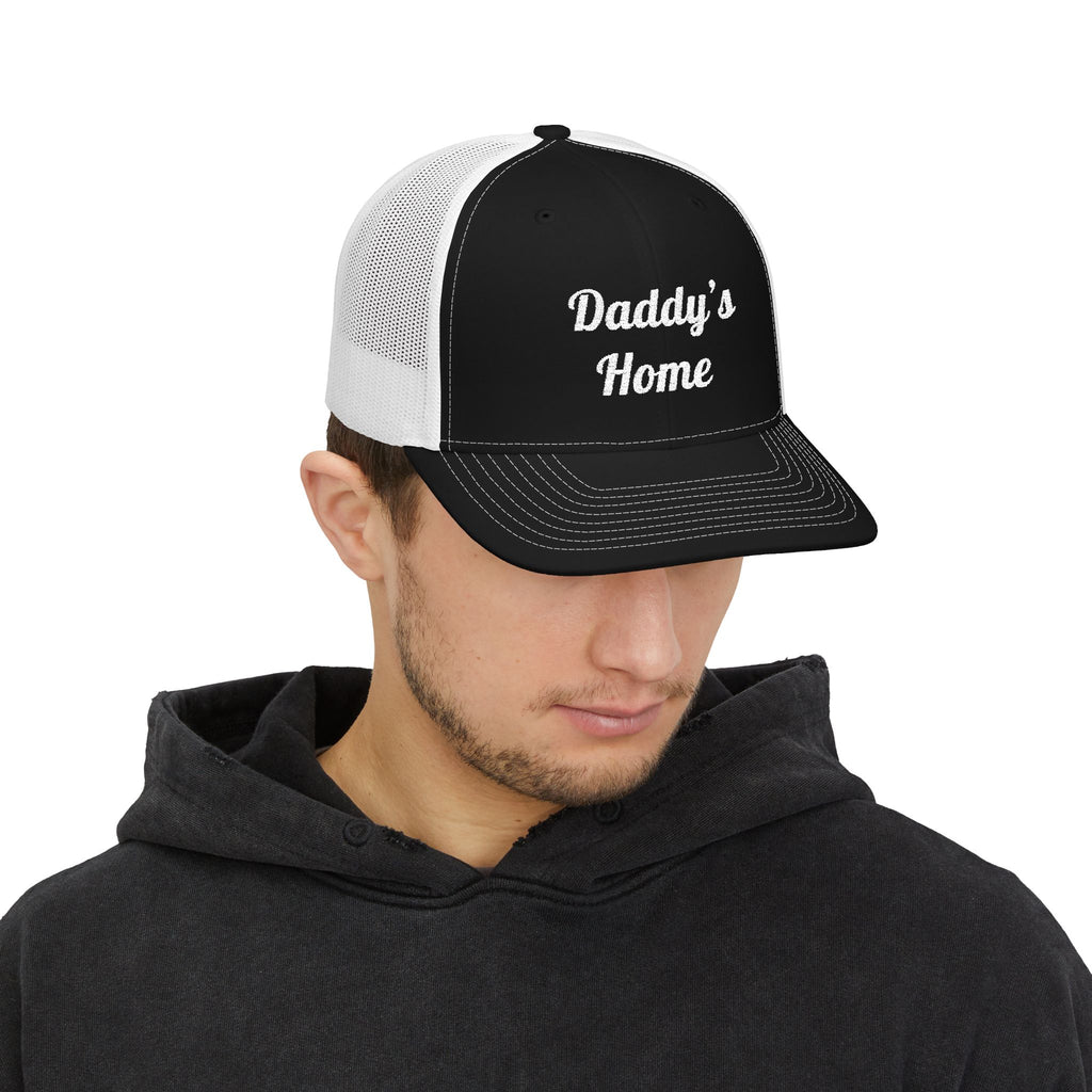 Man wearing a black and white cap with 'Finned Fish for Life' text on a white background