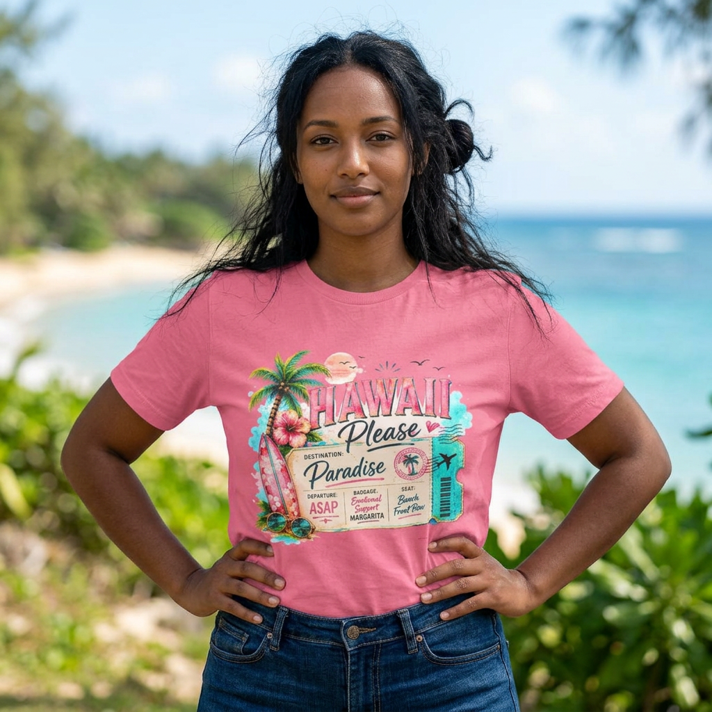 Woman wearing a pink t-shirt with a Hawaii-themed design by the beach.