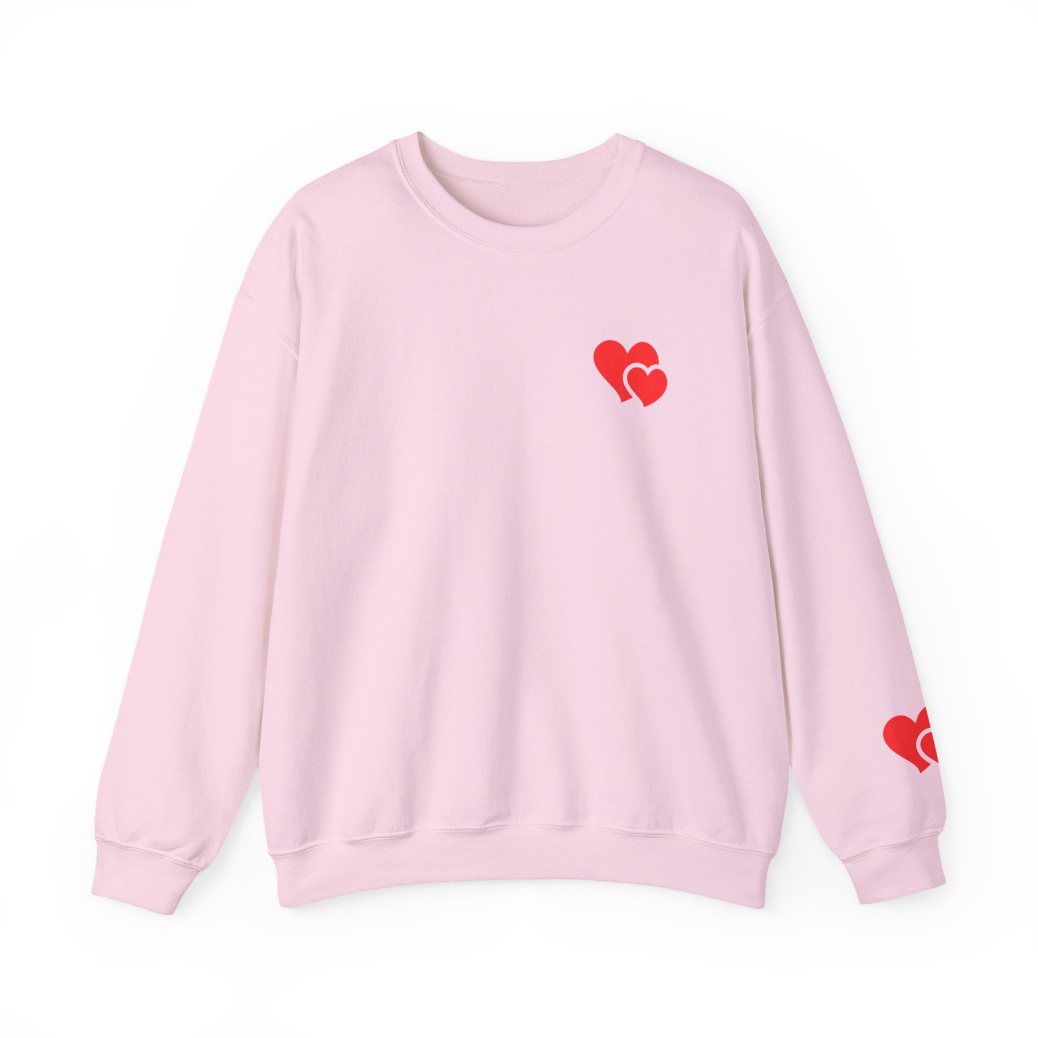 Pink sweatshirt with red heart designs on a white background