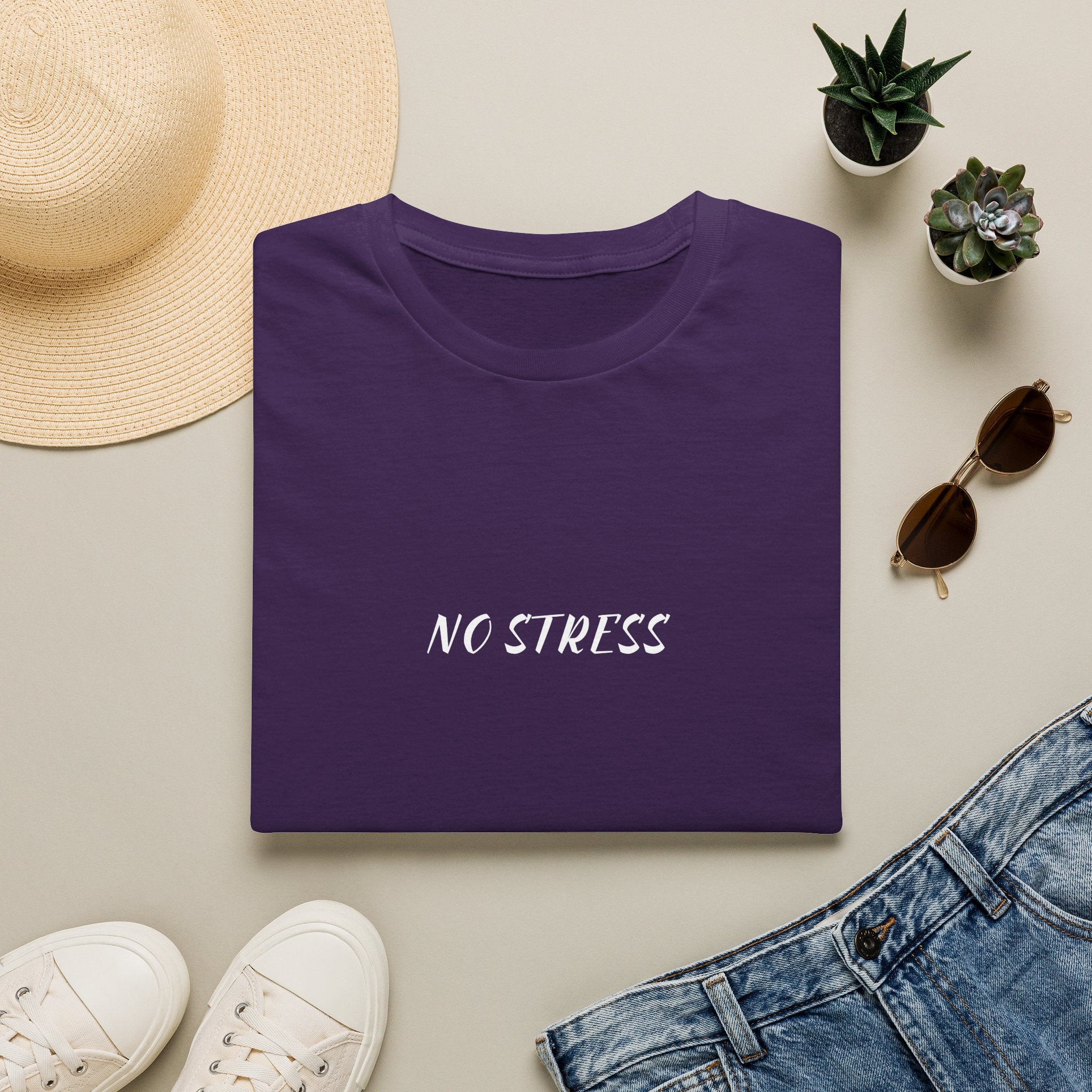 Dark gray t-shirt with 'Hiking Club' text on a light surface with accessories like a hat, sunglasses, and jeans.