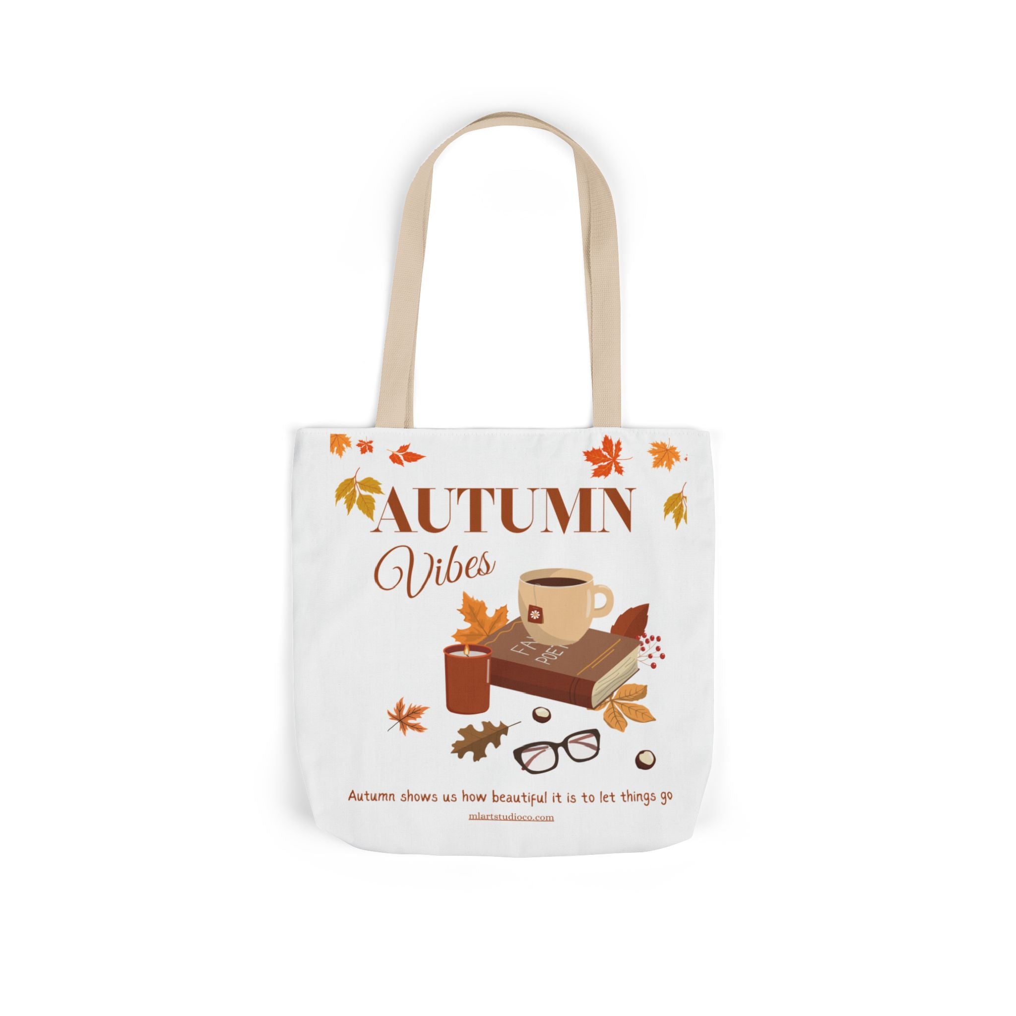Tote bag with 'Autumn Vibes' design featuring a cup, book, and leaves on a white background.