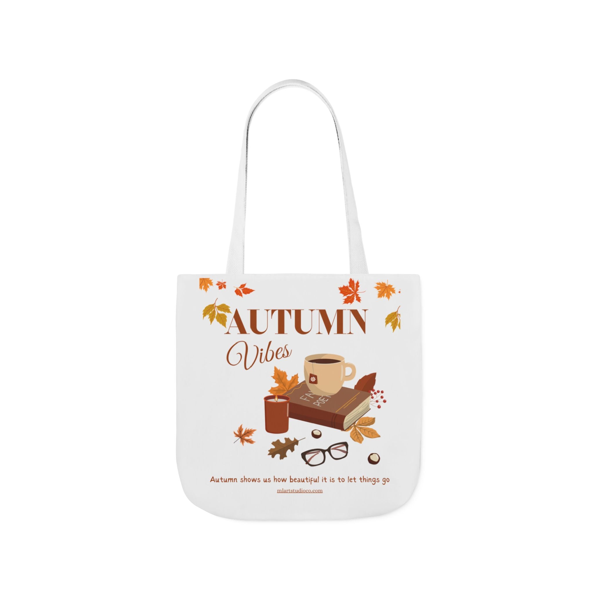Tote bag with 'Autumn Vibes' design featuring a cup, book, and leaves on a white background