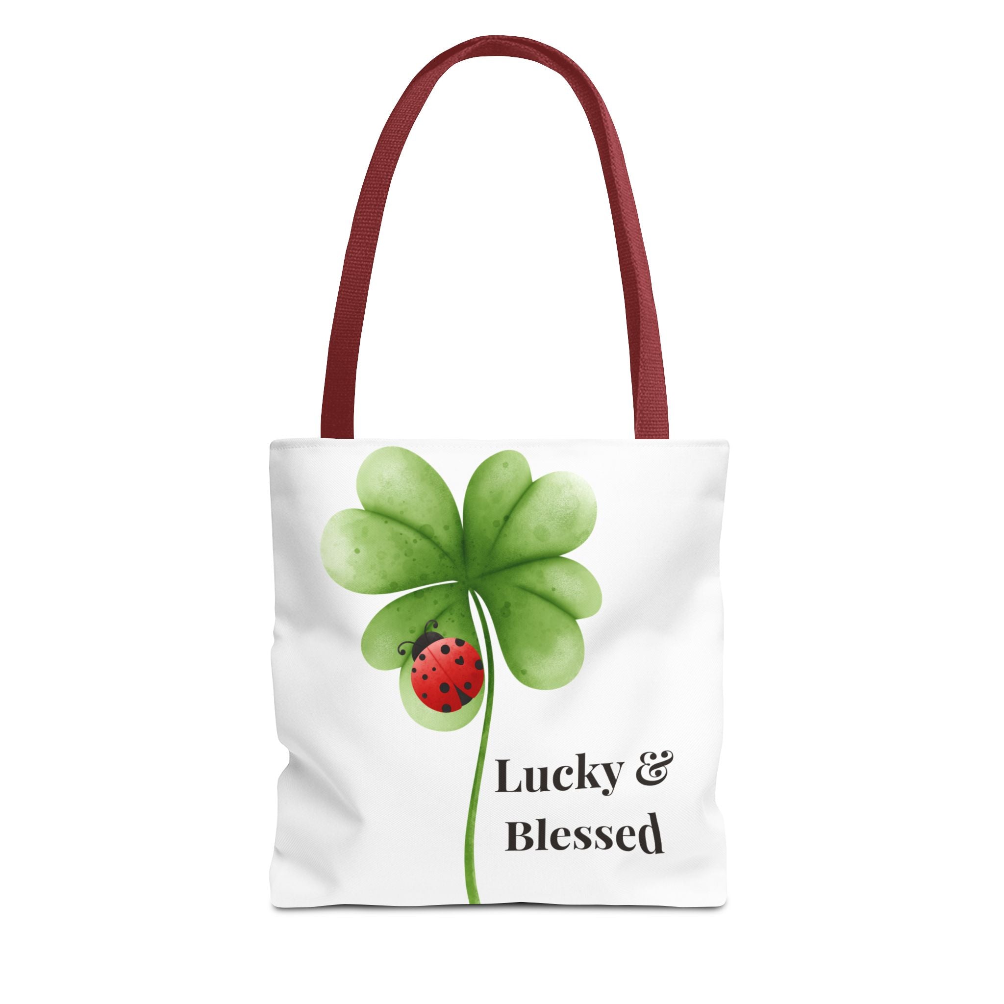 Tote bag with a four-leaf clover and ladybug design on a white background