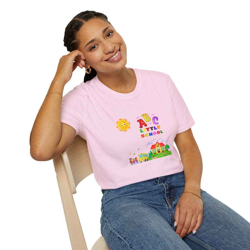 Person wearing a pink t-shirt with 'ABC Little School' design, sitting on a chair.