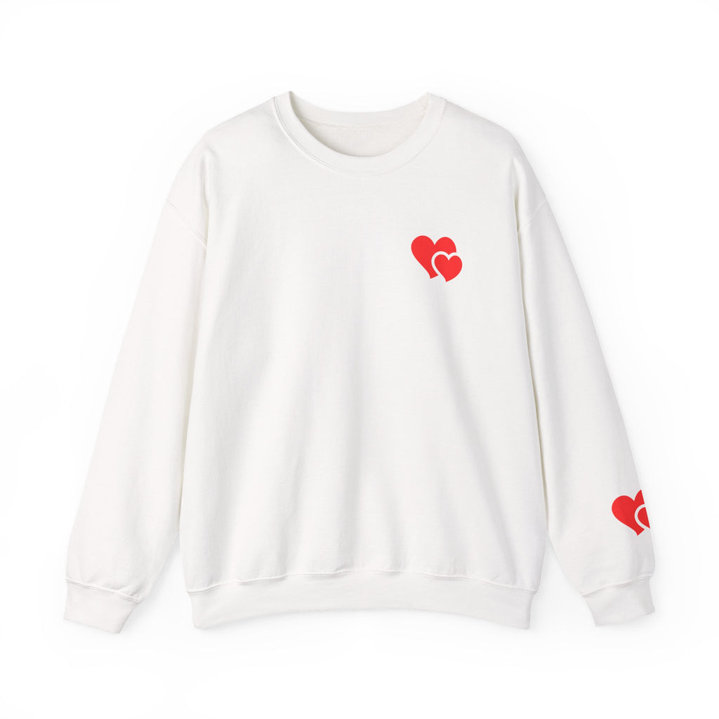 White sweatshirt with red heart designs on a white background