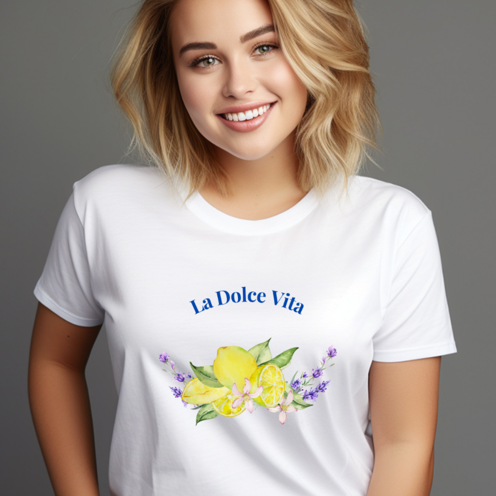 Woman wearing a white t-shirt with 'La Dolce Vita' and floral design on a gray background