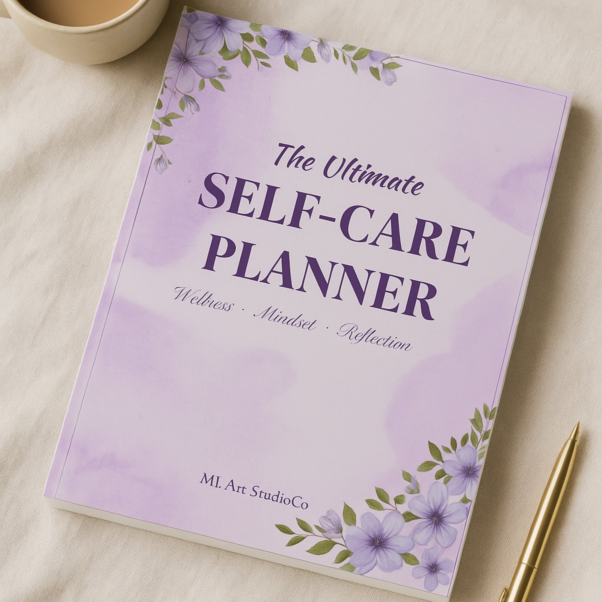 Purple self-care planner with floral design on a light surface with a pen and cup.