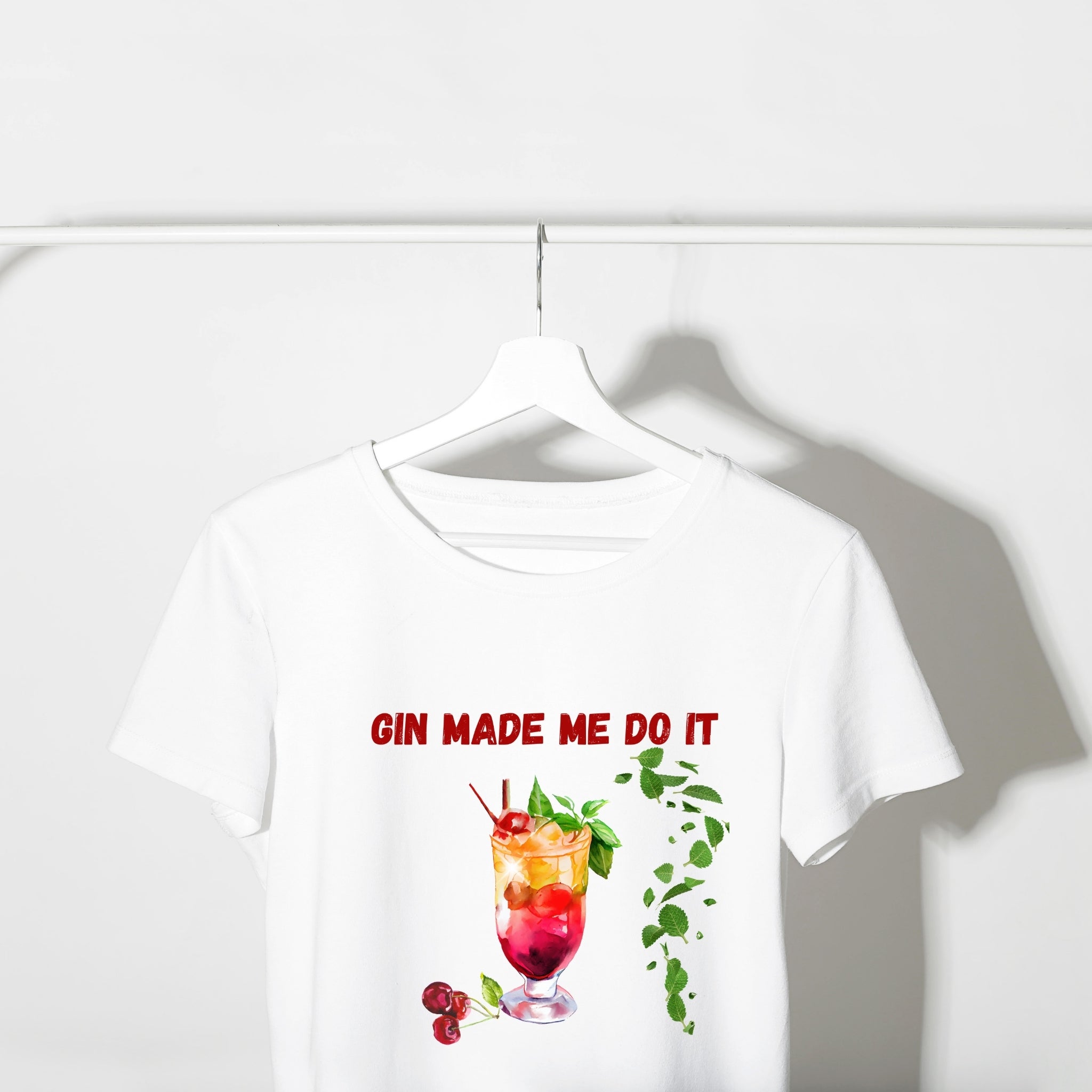 White t-shirt with a graphic of a cocktail and text 'Gin Made Me Do It' on a white background